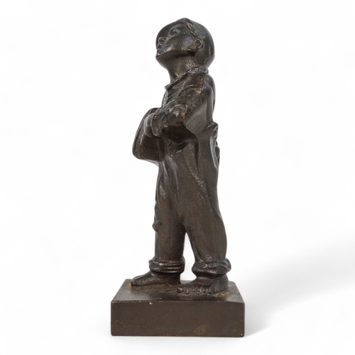 83 - A 20th century cast figure of a boy news vendor - titled 'Speshul', 18cm high, together with a Jagua... 