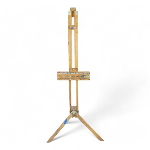 88 - A 20th century beech artist's studio easel - of folding tripod form with some paint transfer, fully ... 