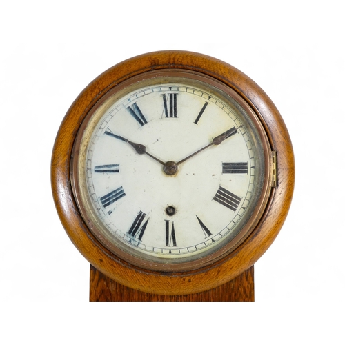 927 - A 19th century oak drop dial wall clock - the white dial set out with Roman numerals, 34cm high.