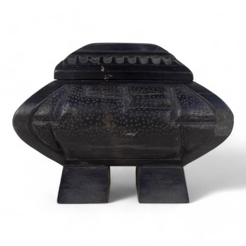 93 - An Anglo Indian 20th century black slate casket - deeply carved with a castellated design and raised... 