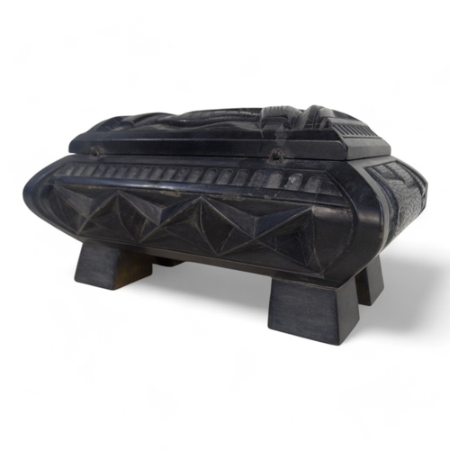 93 - An Anglo Indian 20th century black slate casket - deeply carved with a castellated design and raised... 