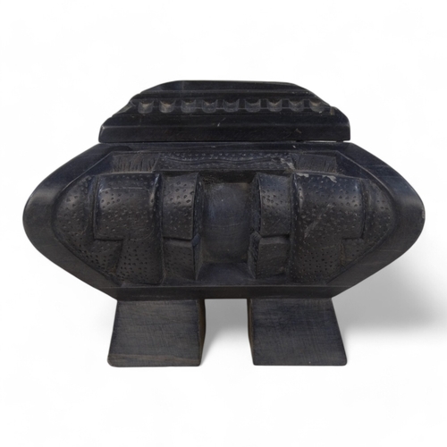 93 - An Anglo Indian 20th century black slate casket - deeply carved with a castellated design and raised... 