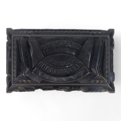 93 - An Anglo Indian 20th century black slate casket - deeply carved with a castellated design and raised... 