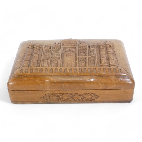 94 - An Anglo Indian carved walnut cigarette box - rectangular carved with an image of an Indian temple, ... 