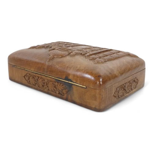 94 - An Anglo Indian carved walnut cigarette box - rectangular carved with an image of an Indian temple, ... 