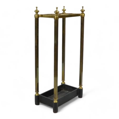 943 - A late 19th century brass and cast iron stick stand - rectangular with square supports, 61cm high.