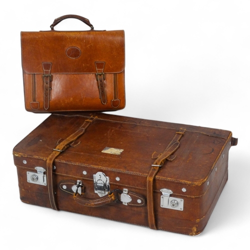 944 - A mid 20th century tan leather suitcase - with chrome fittings, 70cm wide, together with a tan leath... 