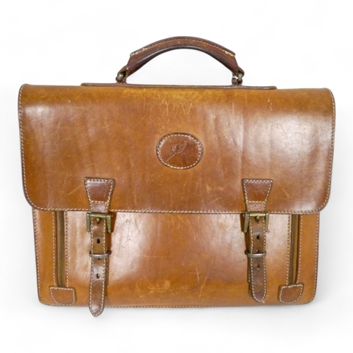 944 - A mid 20th century tan leather suitcase - with chrome fittings, 70cm wide, together with a tan leath... 