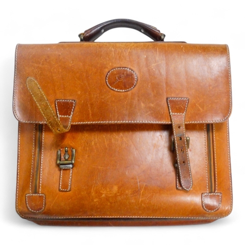 944 - A mid 20th century tan leather suitcase - with chrome fittings, 70cm wide, together with a tan leath... 