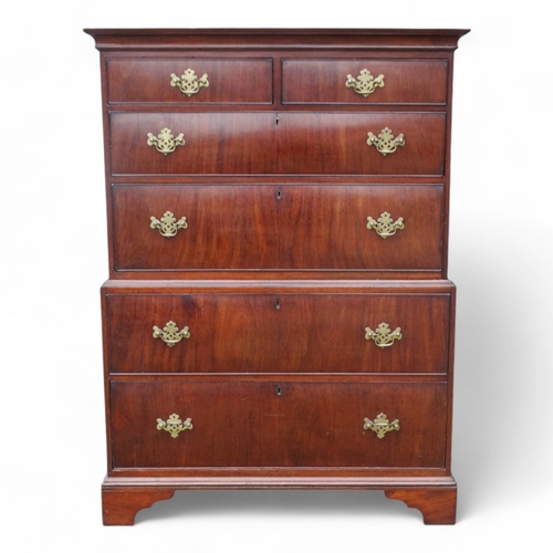 945 - A George II walnut chest on chest - of small proportions, the upper section with an arrangement of t... 