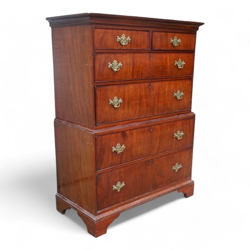 945 - A George II walnut chest on chest - of small proportions, the upper section with an arrangement of t... 