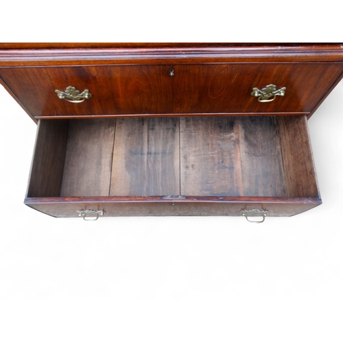 945 - A George II walnut chest on chest - of small proportions, the upper section with an arrangement of t... 