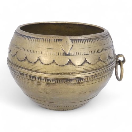 95 - An African brass bowl - with scalloped and linear decoration and a ring handle, 15cm diameter, toget... 