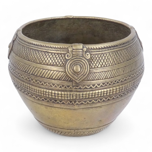 95 - An African brass bowl - with scalloped and linear decoration and a ring handle, 15cm diameter, toget... 