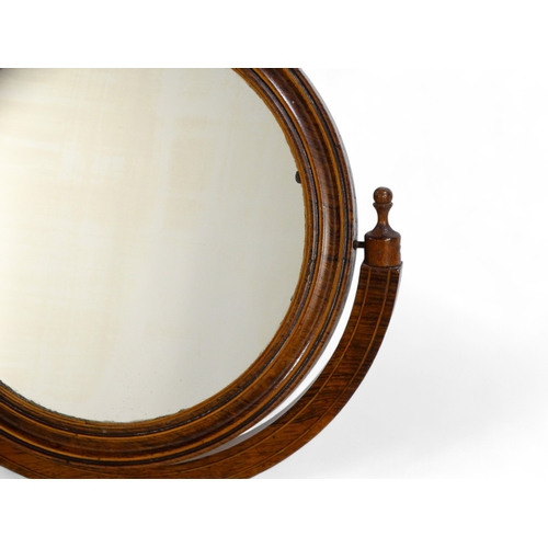 96 - A William IV rosewood shaving mirror - with a circular plate within a tilting frame on a turned supp... 