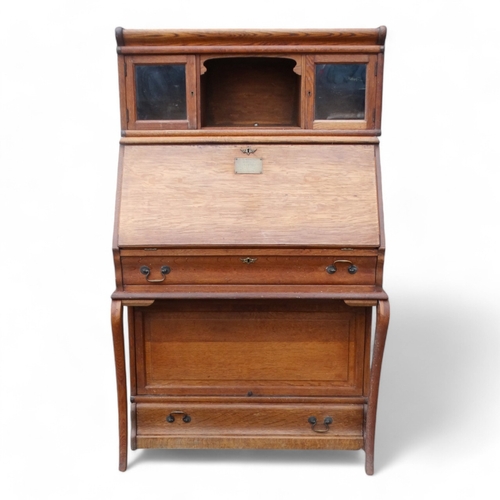 970 - Of First World War Interest - an early 20th century oak Globe Wernicke style bureau bookcase with an... 