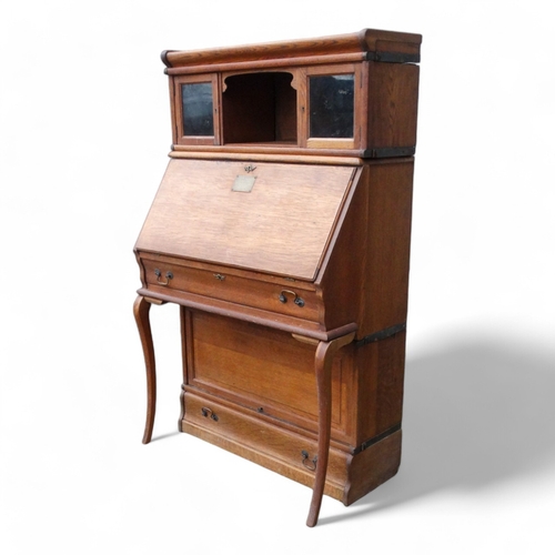 970 - Of First World War Interest - an early 20th century oak Globe Wernicke style bureau bookcase with an... 