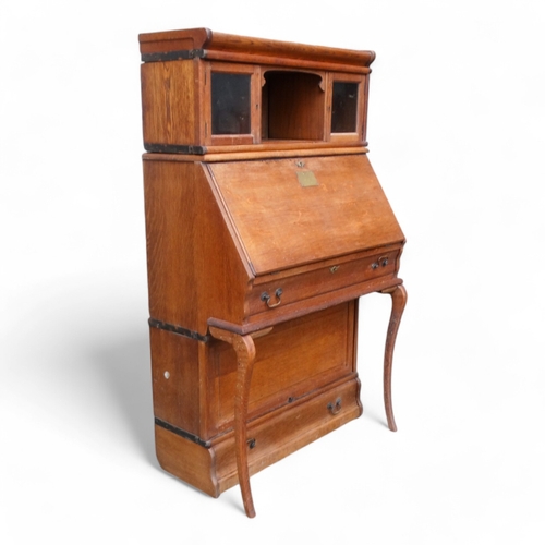 970 - Of First World War Interest - an early 20th century oak Globe Wernicke style bureau bookcase with an... 