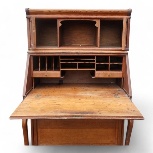 970 - Of First World War Interest - an early 20th century oak Globe Wernicke style bureau bookcase with an... 