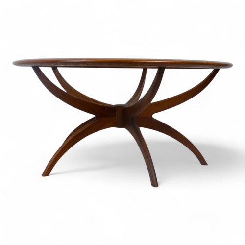 974 - Victor Wilkins for G-Plan - a teak Astro Spider circular table, with inset clear glass top raised on... 