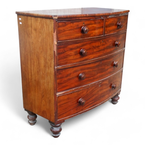 976 - A 19th century mahogany bowfront chest of drawers - with an arrangement of two short and three long ... 