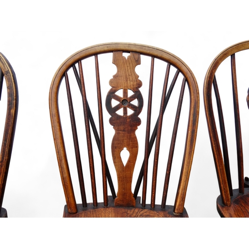 979 - A 19th century harlequin set of eight ash and elm wheel back Thames Valley chairs - with pierced spl... 