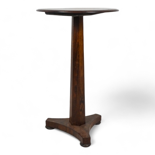 980 - An early Victorian rosewood occasional table - the circular top above a tapering octagonal support a... 