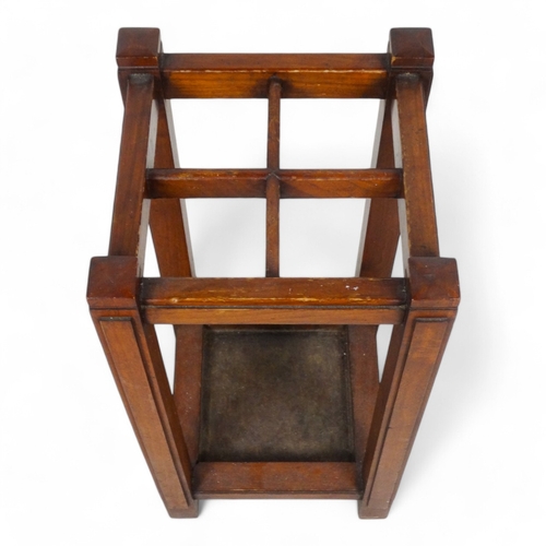 981 - An early 20th century walnut stick stand - in an Art Deco style, square with four divisions 31 x 31 ... 