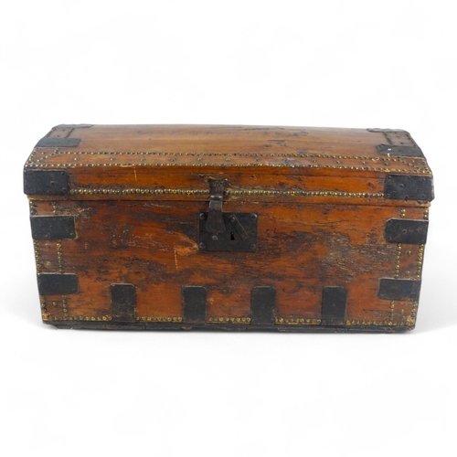 984 - A 19th century pine dome topped trunk - with steel binding, brass studs and drop handles, 89 x 50 x ... 