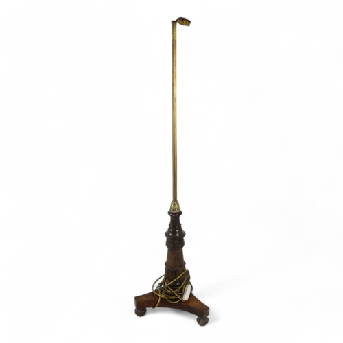 986 - A William IV rosewood firescreen stand - now converted as a standard lamp, with a tripod base, 136cm... 