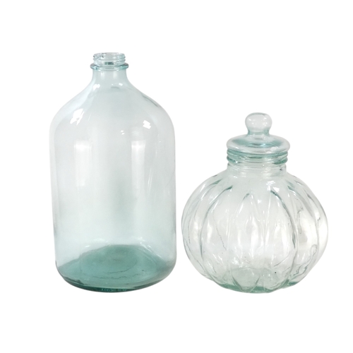 104 - A large glass jar - with a narrow screw neck top, 50cm high, together with another gourd shaped lidd... 