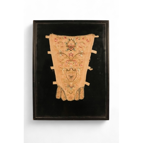 105 - An 18th century embroidered bodice panel - floral decorated on a cream ground, 31cm high, framed and... 