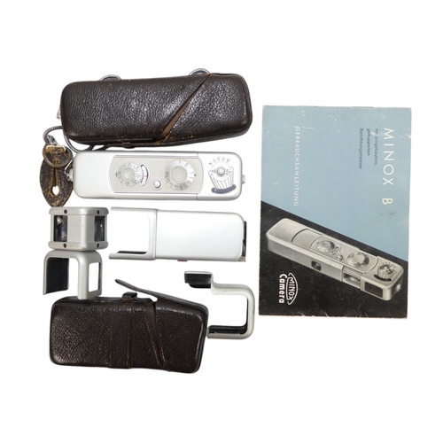 119 - A Minox model B miniature camera - no. 947 466, with flash, sundry fittings, owner's manual and oute... 