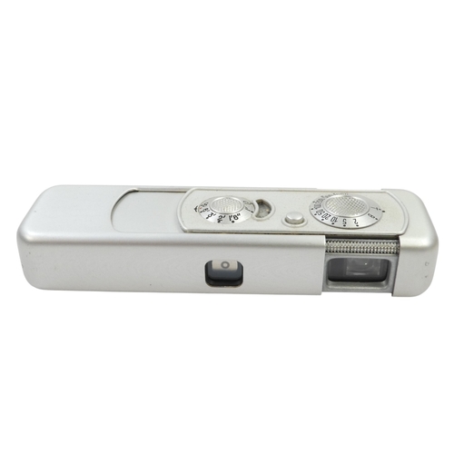 130 - A Minox model B miniature camera - no. 87 389, circa 1952, with a brown leather case.