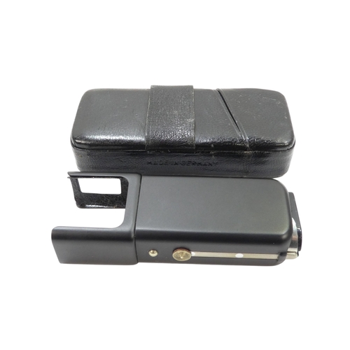 132 - A Minox model B miniature camera - with a black finish, no 782 355, with both flash and flash cube a... 