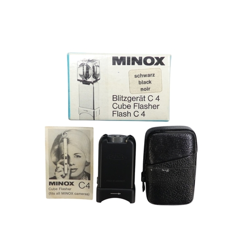 132 - A Minox model B miniature camera - with a black finish, no 782 355, with both flash and flash cube a... 