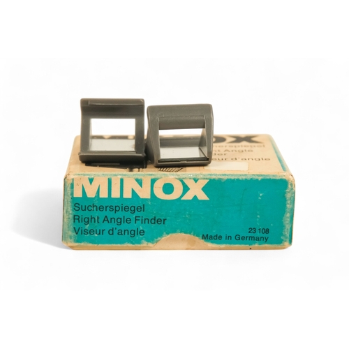 145 - A collection of Minox camera accessories - including camera clamp, viewing magnifier and cutter, lig... 