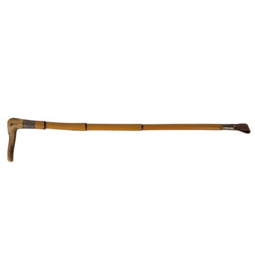 15 - An early 20th century riding crop - bamboo and fitted with a whistle to the handle, together with a ... 