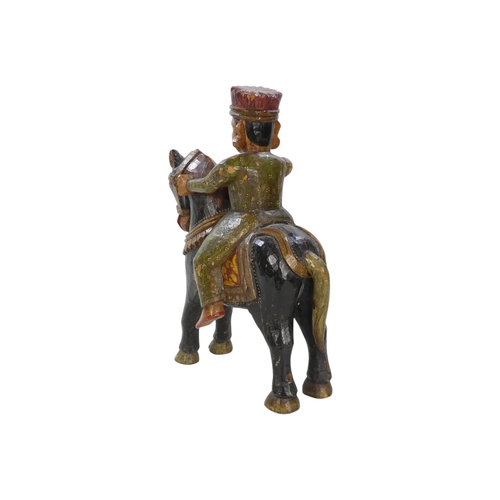 154 - A 20th century carved hardwood and polychrome painted tiger - 59cm wide, together with another of an... 