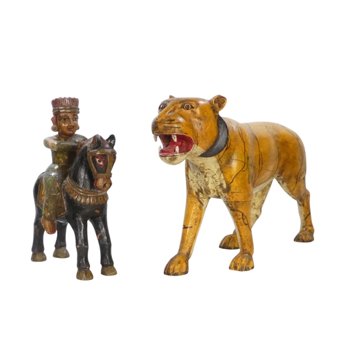 154 - A 20th century carved hardwood and polychrome painted tiger - 59cm wide, together with another of an... 