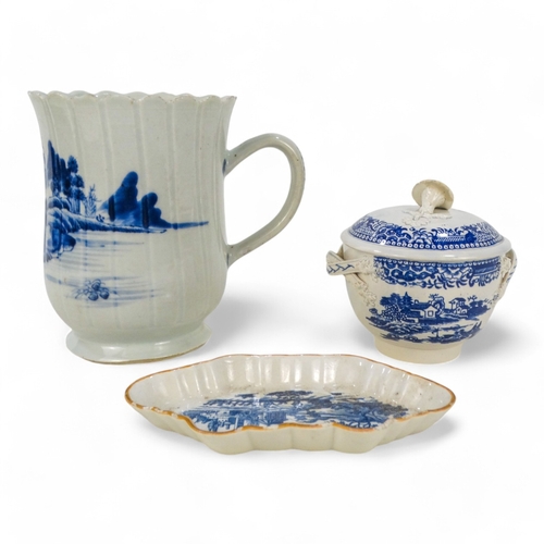 206 - A 19th century chinoiserie pearlware mug - decorated with a bridge and temple, 13cm high.