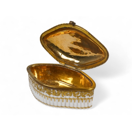 214 - A 19th century Meissen patch box - navette shaped with a ribbed body and a gilt metal interior, 9cm ... 