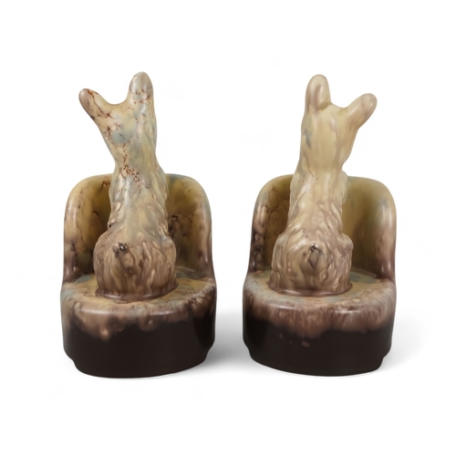 217 - A pair of Beswick bookends - modelled as Scottie dogs with a plum and cream graduated marbled finish... 