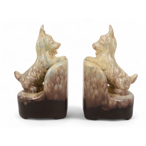 217 - A pair of Beswick bookends - modelled as Scottie dogs with a plum and cream graduated marbled finish... 