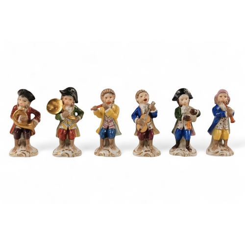 223 - A Sitzendorf Meissen style monkey band - comprising a conductor and eleven musicians, each approx 10... 