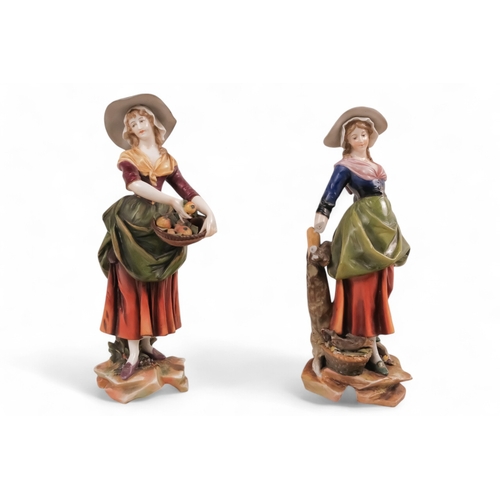 233 - A pair of early 20th century German figures - modelled as peasant girls displaying their wares, 24cm... 