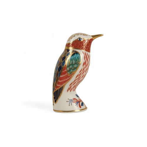 235 - A Royal Crown Derby kingfisher paperweight - perched with a fish, 11cm high, together with two furth... 