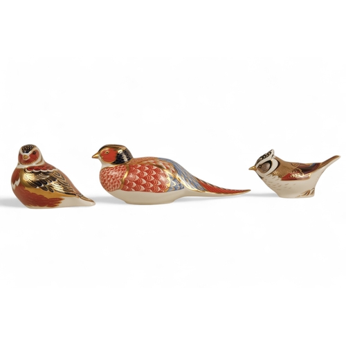 237 - A Royal Crown Derby pheasant paperweight - 7cm high, together with two further birds. (3)