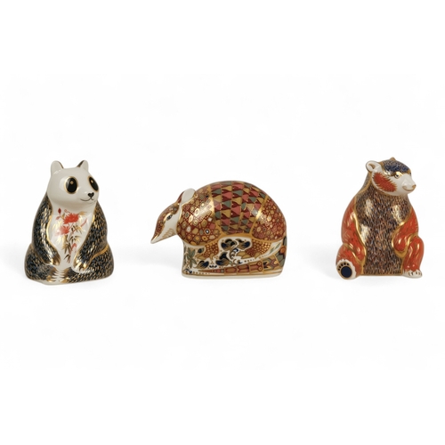 239 - A Royal Crown Derby armadillo paperweight - 9cm high, together with a panda and a bear. (3)