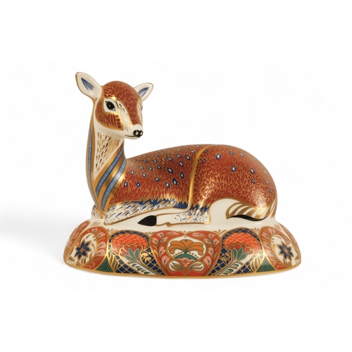 241 - A Royal Crown Derby deer paperweight - in a recumbent pose, 13cm high.